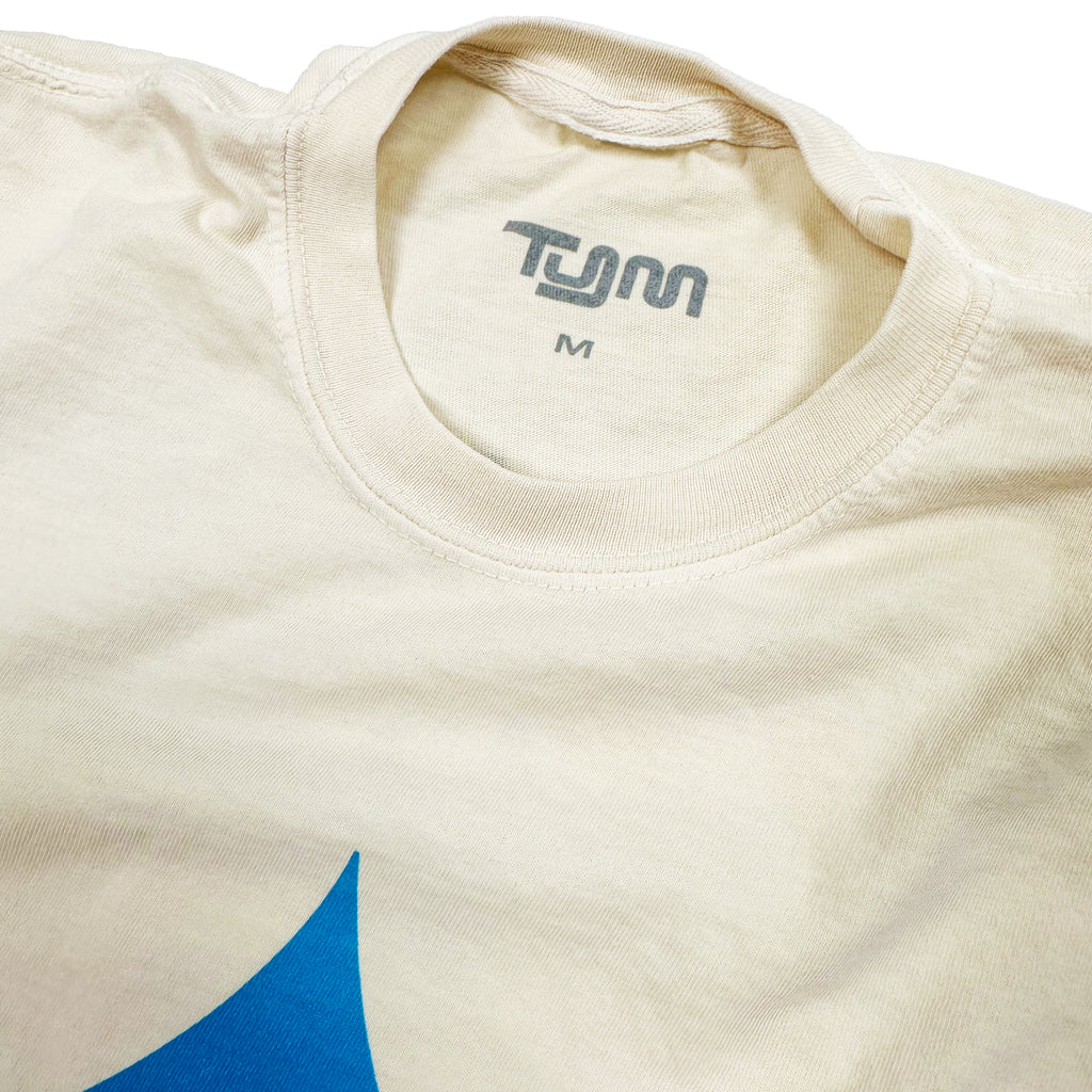 A grey inside tag print that says "TYM" in medium.