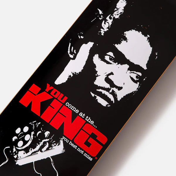 A King skateboard with the words "KING RULES" on it.
