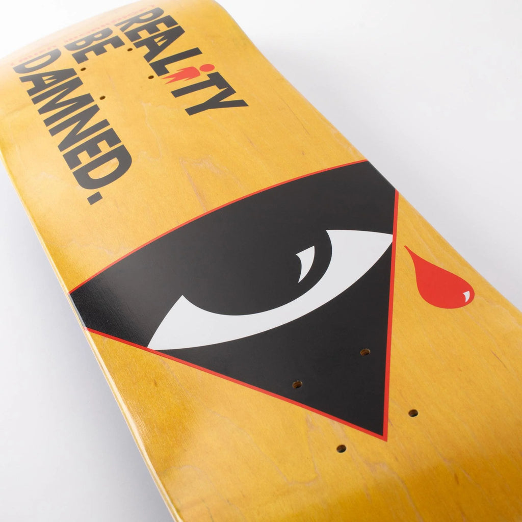 Close-up of an ALIEN WORKSHOP KTC/RBD PSY skateboard deck with an eye graphic and the text "reality be damned.