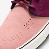 A pink and purple nike SB ZOOM JANOSKI OG+ RED STARDUST / ROSEWOOD sneaker with white laces.