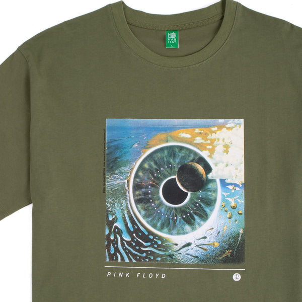 A HABITAT X PINK FLOYD PULSE TEE OLIVE featuring Pink Floyd’s “P.U.L.S.E” album cover, depicting an artistic eye design with celestial themes. The band's name, "Pink Floyd," is printed below the image.