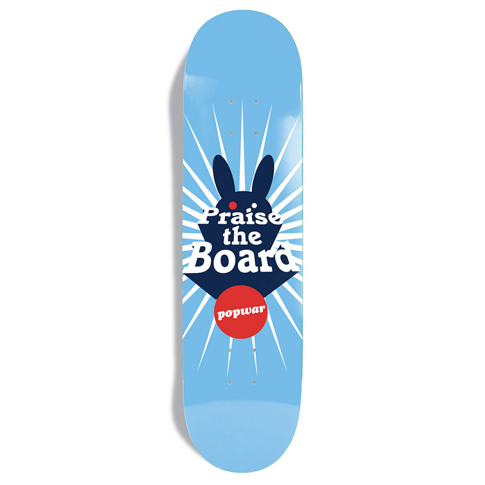 The CHOCOLATE POPWAR PRAISE THE BOARD deck features a dark blue bunny, white rays, and "Praise the Board" in a red circle—a tribute to Cairo Foster’s Heritage program.