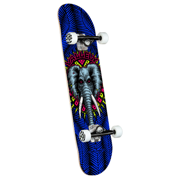 A complete royal blue Powell Peralta Vallely Elephant skateboard with branded text on an isolated white background.