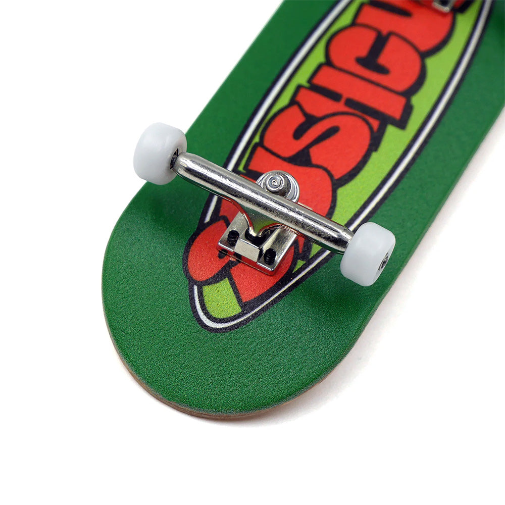 A close-up of the SLUSHCULT "GROM" Series 009 Fingerboard New Oval, an entry-level green fingerboard with white wheels and a colorful graphic—ideal for beginners.