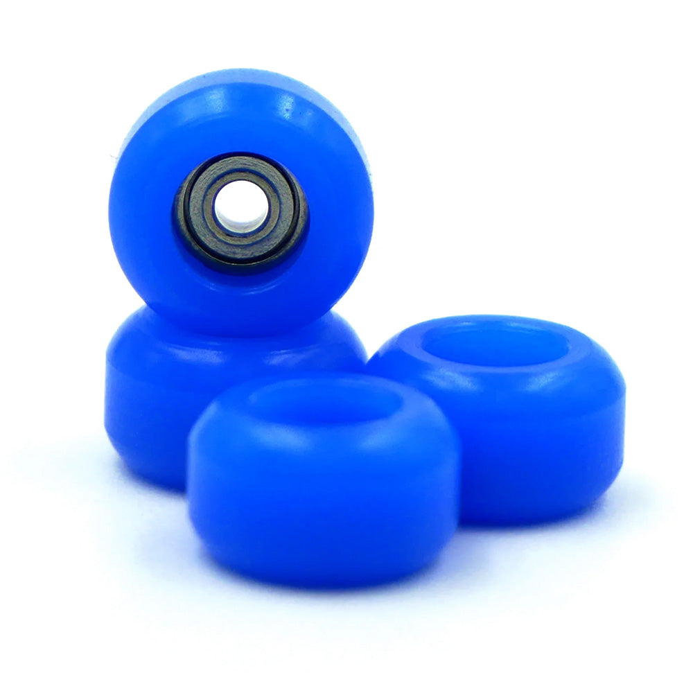 Four SLUSHCULT GROM FINGERBOARD WHEELS ROYAL by SLUSHCULT, featuring precision bearings, are stacked neatly on a white background—perfect for fingerboard enthusiasts or skate setups.