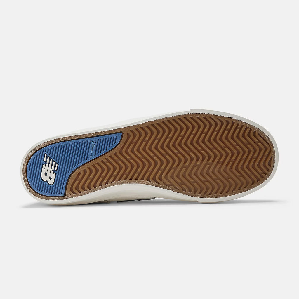 Sole of a vulcanized skate shoe with herringbone pattern and a blue NB Numeric logo.