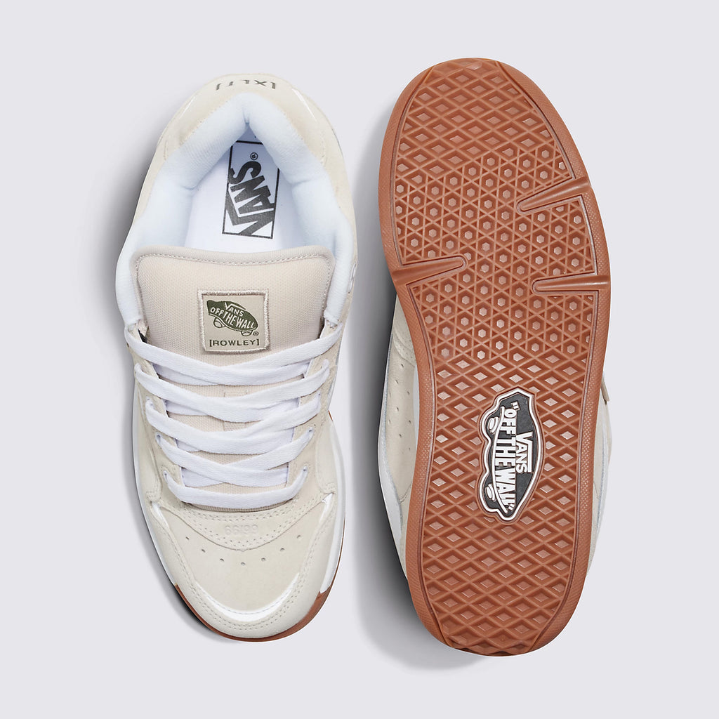 A pair of Vans ROWLEY XLT UTILITY RAINY DAY skateboarding shoes featuring white uppers and brown soles, displayed from above with one shoe flipped to show the sole.