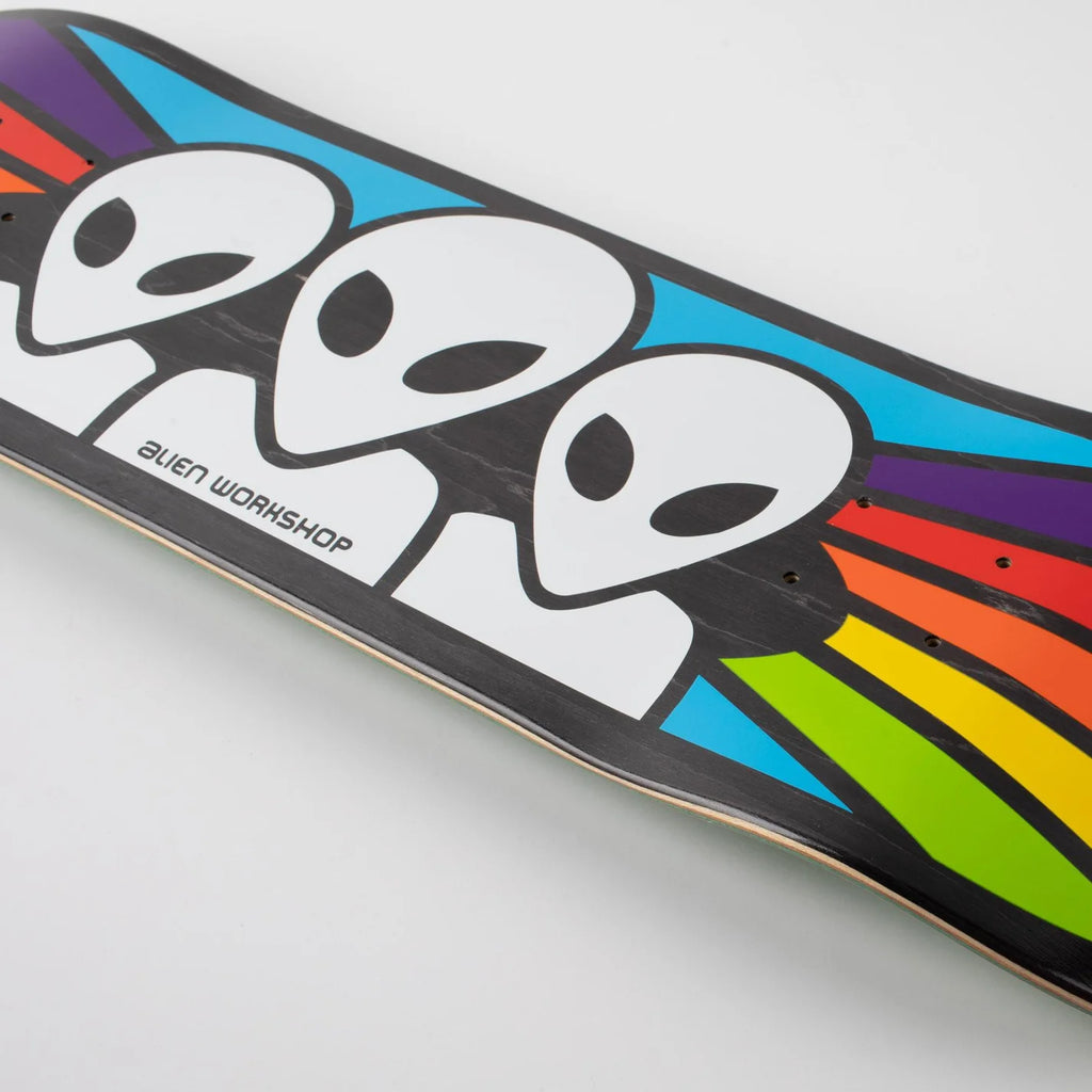 A skateboard with a colorful design featuring alien heads and the text "ALIEN WORKSHOP SPECTRUM FULL TWIN" on its Twin Tail 8.5 Shape.