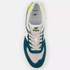 Top view of a pair of new NB NUMERIC 574 VULC DEEP OCEAN / SUNFLOWER sneakers with a vulcanized sole.