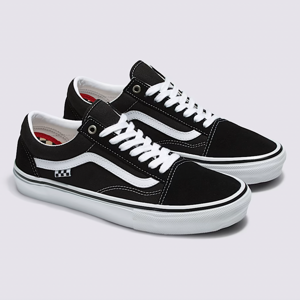 A pair of VANS SKATE OLD SKOOL BLACK / WHITE sneakers by VANS, featuring white laces and soles, signature side stripe, DURACAP reinforcement, and a small checkered accent near the heel.