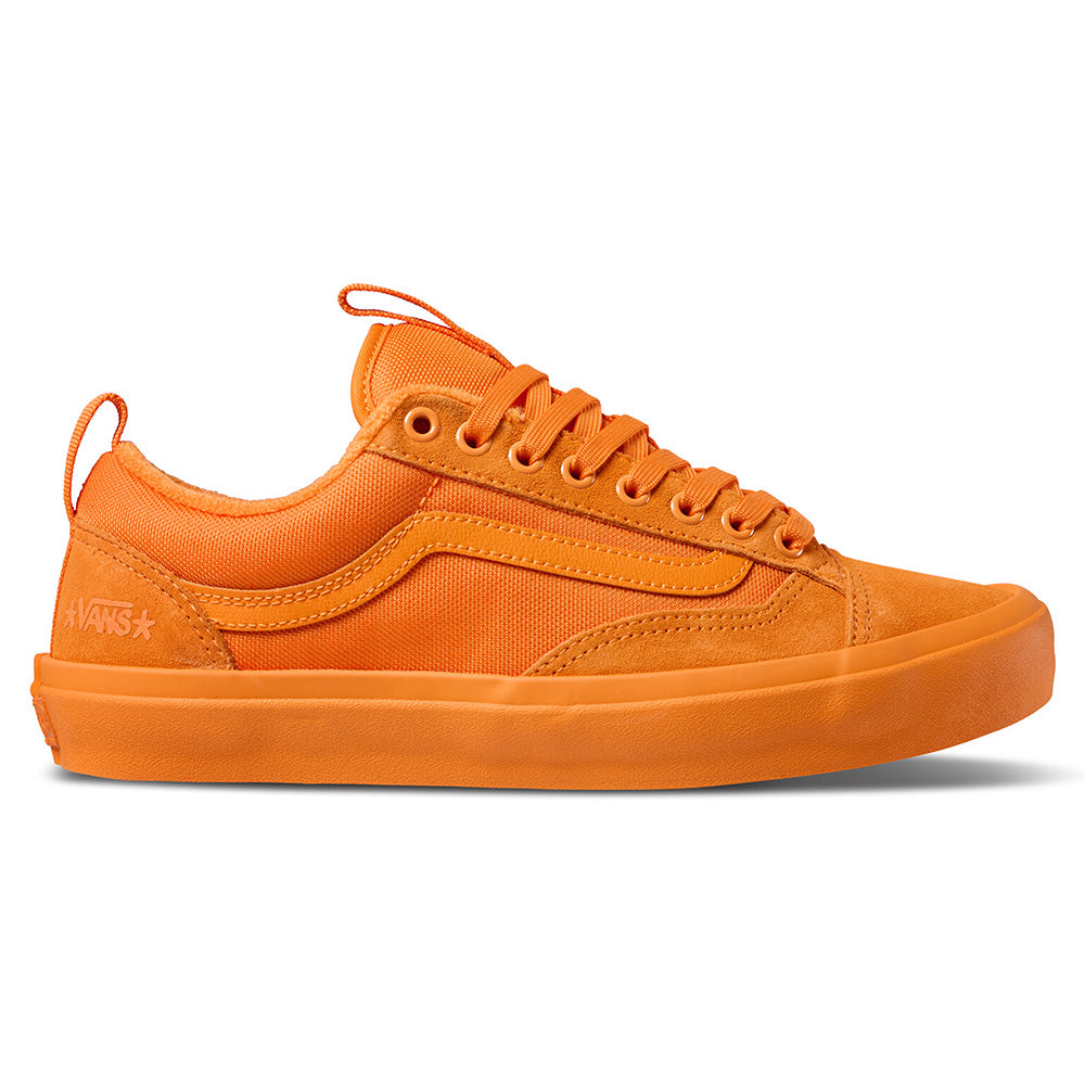 The VANS X ATIBA SKATE OLD SKOOL 36+ SOLAR is a vibrant orange low-top skate shoe featuring a rubber sole, suede and canvas upper, visible stitching, and lace-up closure.