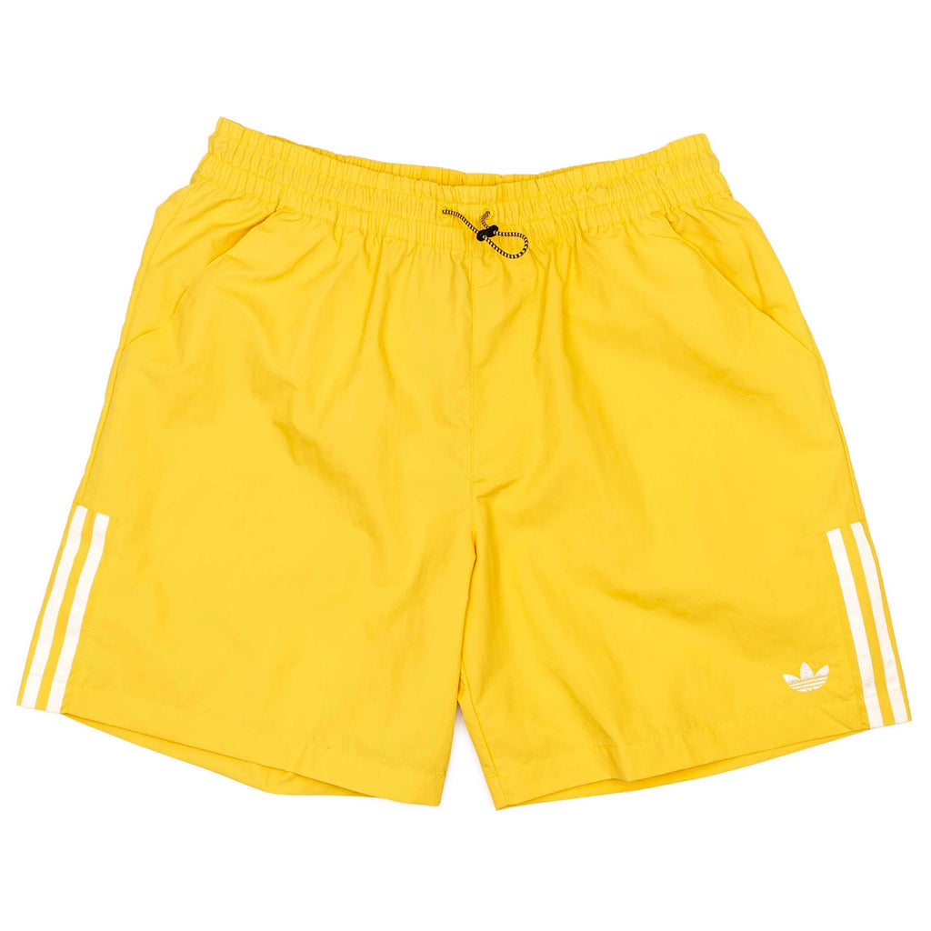 ADIDAS WATER SHORT BOLD GOLD/CREAM WHITE by ADIDAS: bright yellow, gender-neutral skateboarding shorts with an elastic waistband, black drawstring, white side stripes, and Adidas logo on the left leg for versatile style.