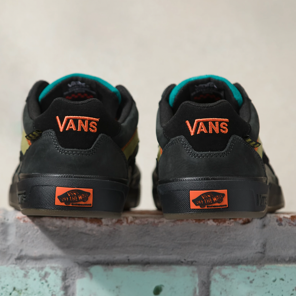 a pair of black and orange VANS SKATE WAYVEE OUTDOOR UNEXPLORED sneakers.