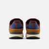 A pair of NB NUMERIC 1010 Tiago Brown/Blue shoes on a white background.