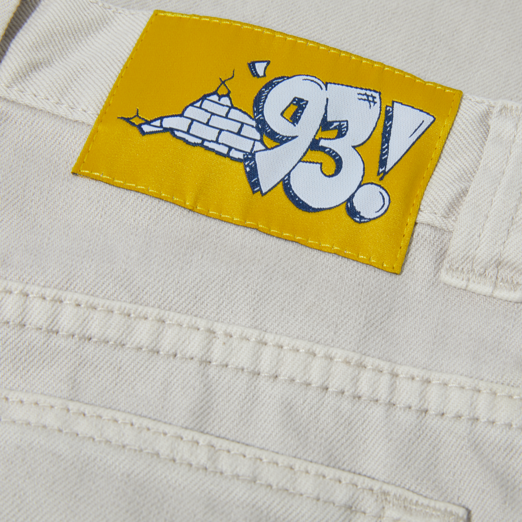a patch on the back of a pair of POLAR '93! DENIM PALE TAUPE pants from POLAR.