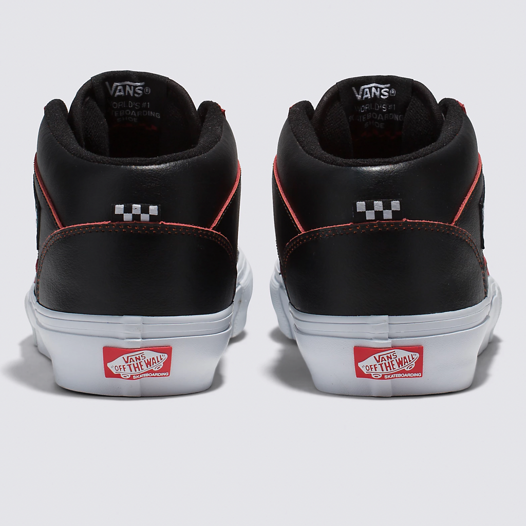 A pair of black and red VANS SKATE HALF CAB WEARAWAY BLACK / ORANGE sneakers.