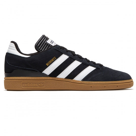A pair of black and white Adidas Busenitz sneakers.