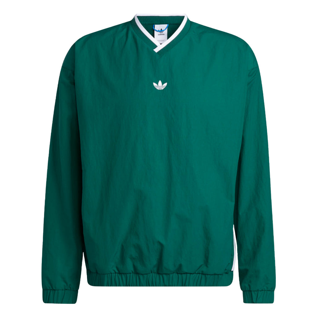 The ADIDAS WIND PULLOVER COLLEGIATE GREEN/WHITE is a vintage nylon golf windbreaker featuring long sleeves, a white V-neck collar, and chest logo for classic style and lightweight comfort.