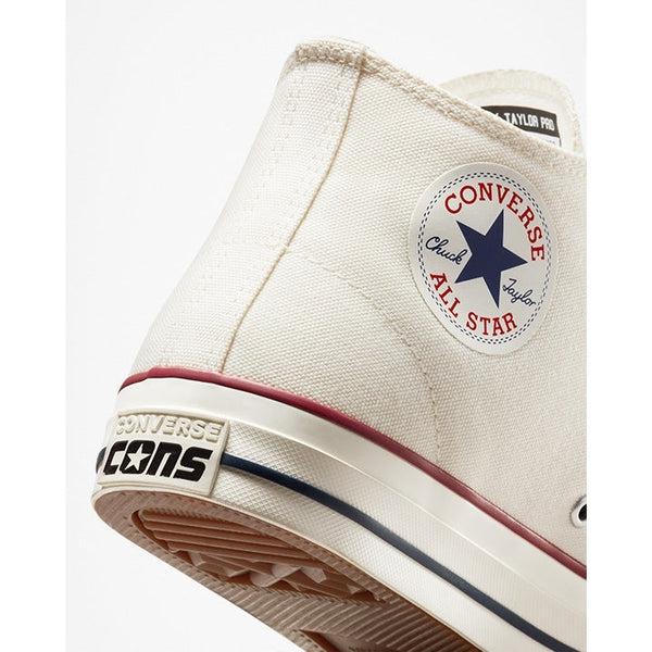 A pair of white Converse CONS Chuck Taylor All Star Pro Mid Egret / Red / Clematis Blue sneakers with a blue star on the side.