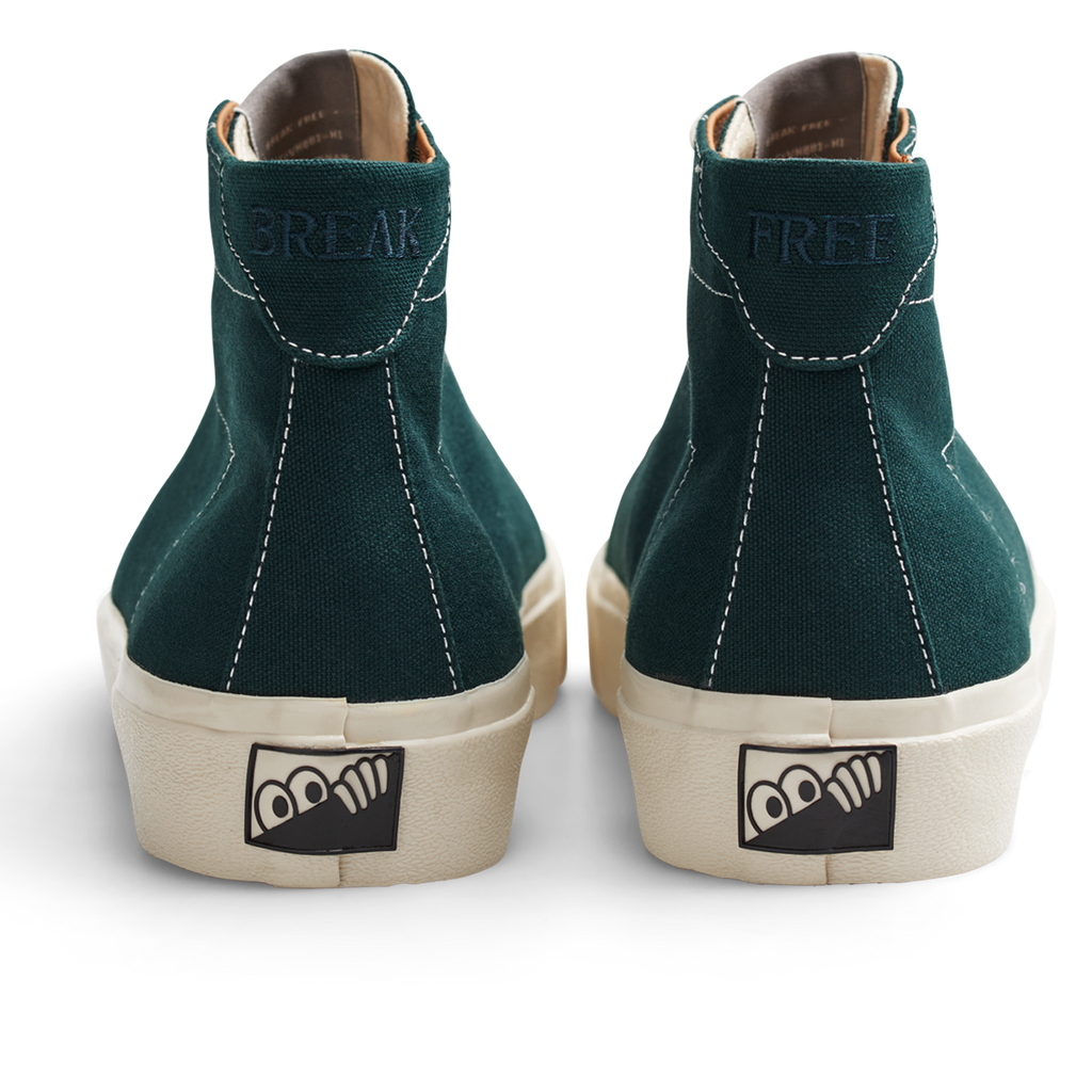 A pair of LAST RESORT AB VM001 HI CANVAS EMERALD/WHITE sneakers with a white logo on the side.