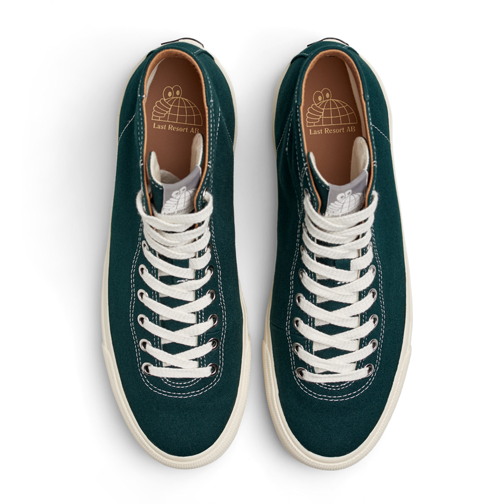 A pair of LAST RESORT AB VM001 HI CANVAS EMERALD/WHITE sneakers with white laces.