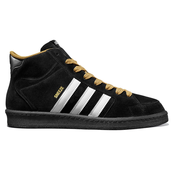 An ADIDAS X SNEEZE SUPERSKATE CORE BLACK / FTWR WHITE / GOLDEN BEIGE sneaker with gold detailing.