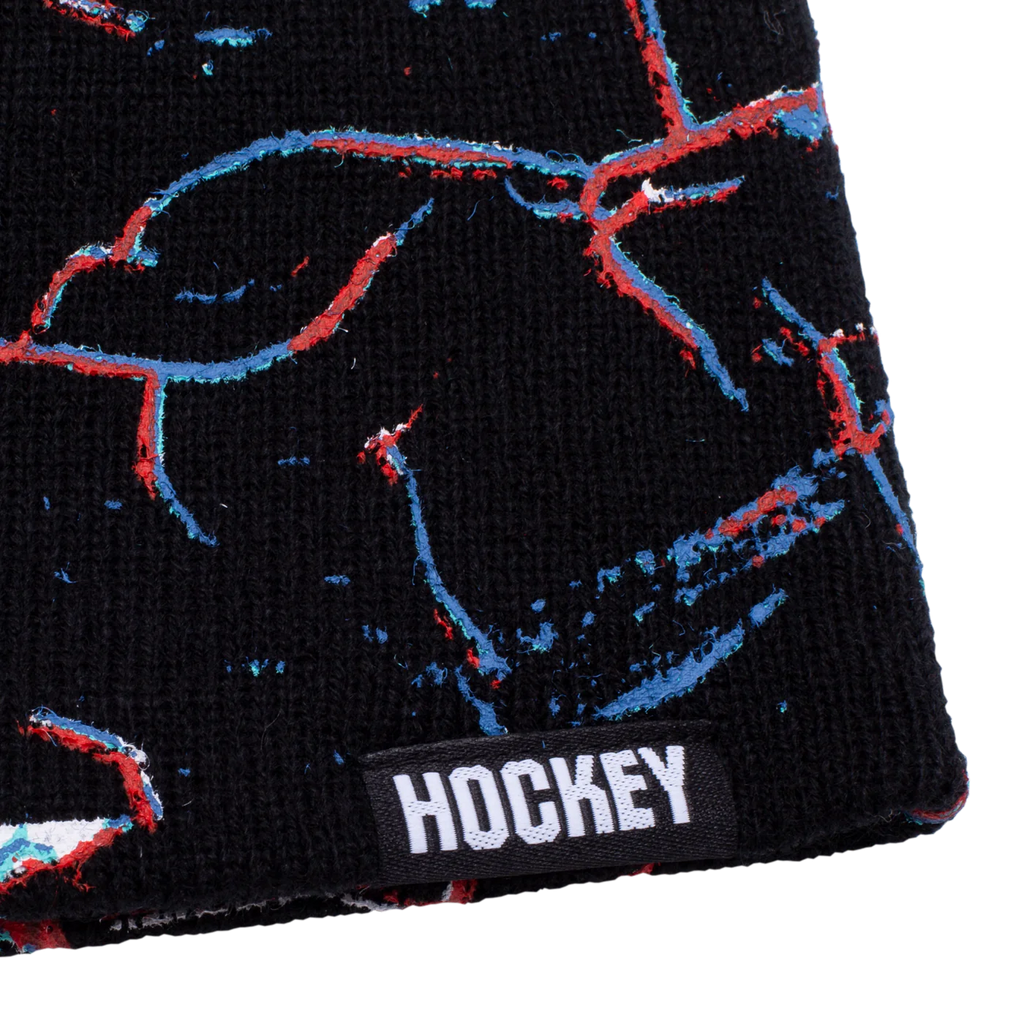 A black HOCKEY NIKITA beanie with the word hockey on it.