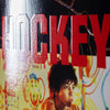 A close up of a HOCKEY NIKITA NIK STAIN poster with a man on it.