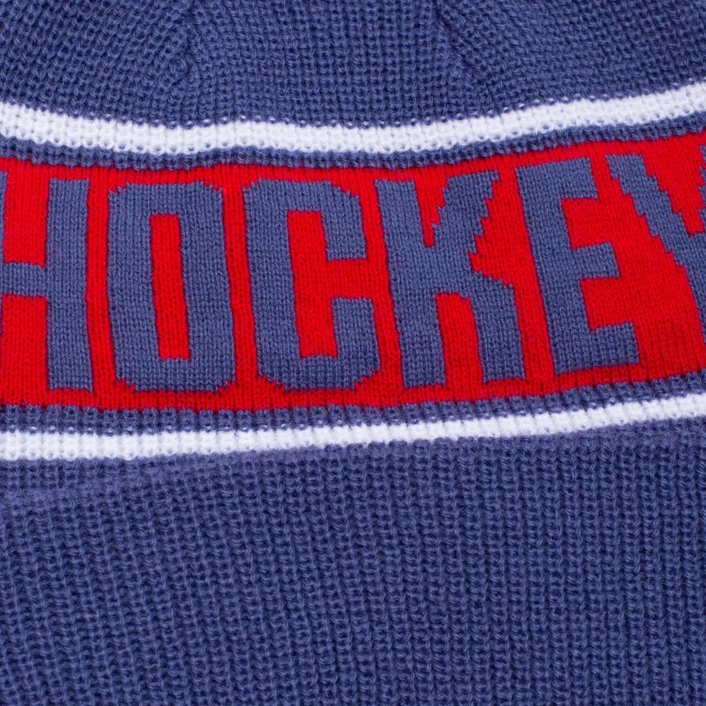 A HOCKEY beanie with the word hockey on it.
