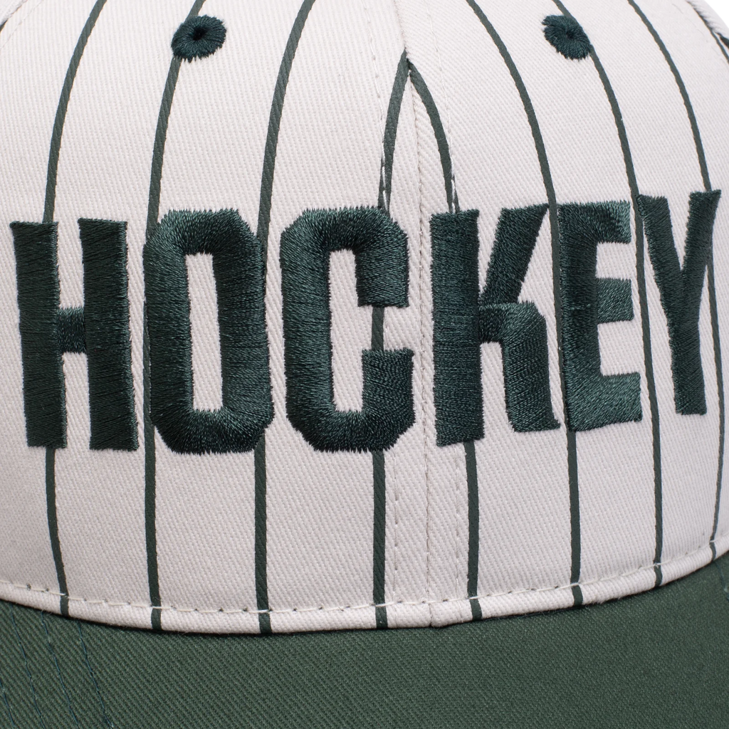 A close up of the embroidery of the word "hockey" on the hat.