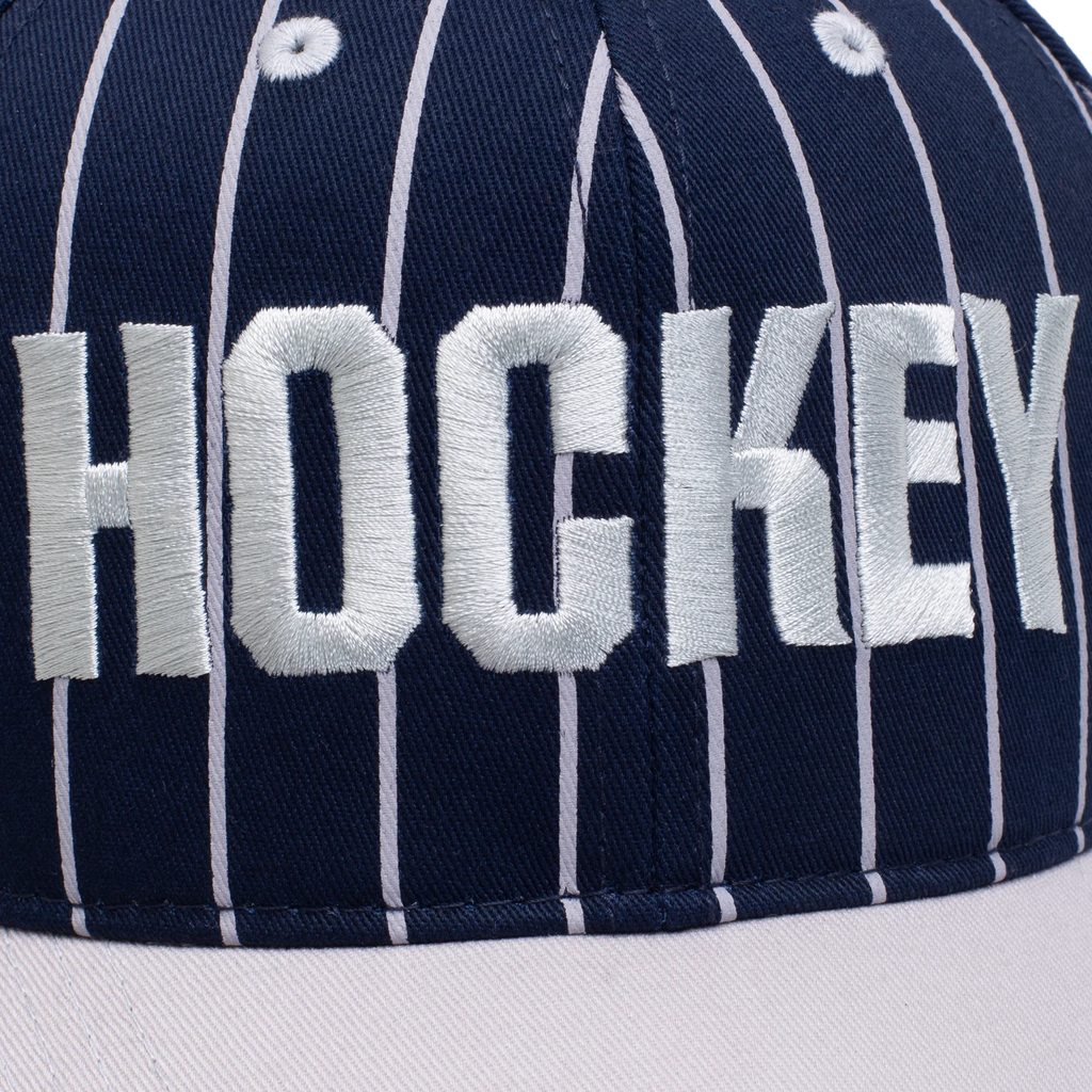 A close up of the word "hockey" embroidered on the front of the hat.