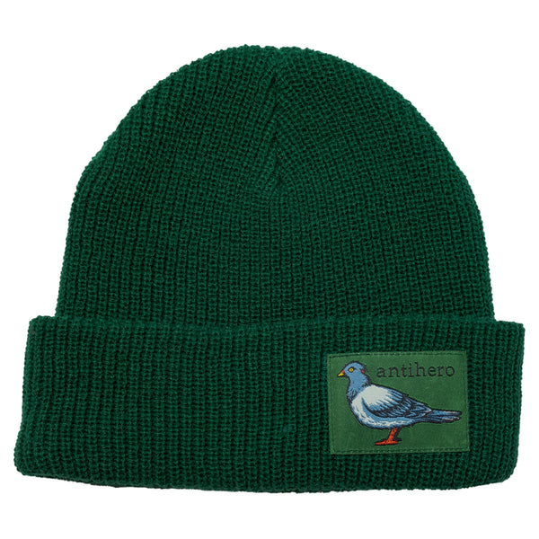 A dark green beanie with a patch of a pigeon.