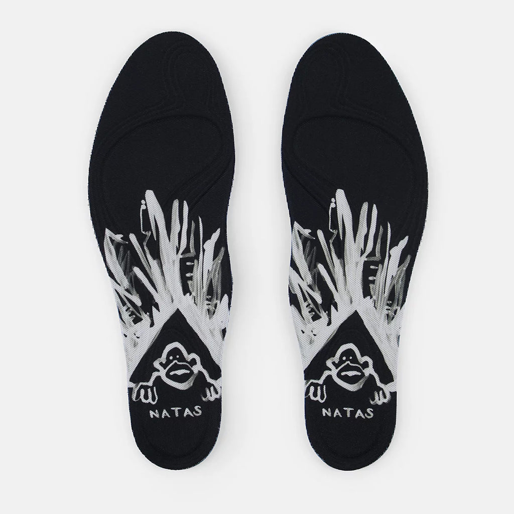 NB NUMERIC NB NUMERIC X NATAS KAUPAS 480 HIGH BLACK / LIME GREEN insoles designed for skaters' shoes, featuring white graphic elements and an illustration of a cartoon figure labeled "NATAS," capturing the essence of life on and off the board.