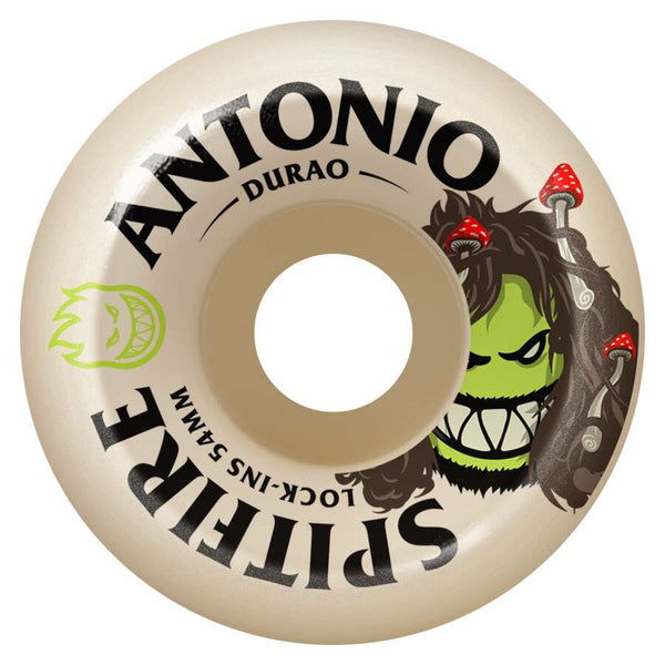 A SPITFIRE F4 DURAO BURN SQUAD LOCK-INS 99D 54MM wheel featuring a green grinning face with mushrooms in its hair, and "ANTONIO DURAO SPITFIRE BURN SQUAD LOCK-INS 54MM" text on the side. Made with Formula Four urethane.