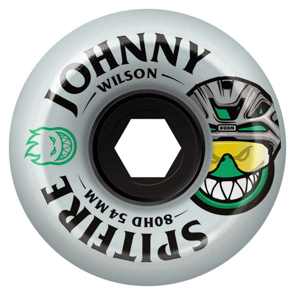 SPITFIRE F4 JOHNNY BURN SQUAD 80HD 54MM skateboard wheel by SPITFIRE, featuring "BURN SQUAD RADIAL," 80HD 54mm urethane (80 duro), plus two cartoon faces—one green, one in a yellow-visor helmet.