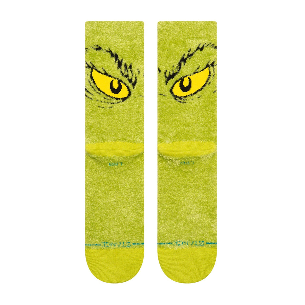 A pair of green STANCE SOCKS X THE GRINCH "DA DA DAGRINCH" GREEN LARGE.