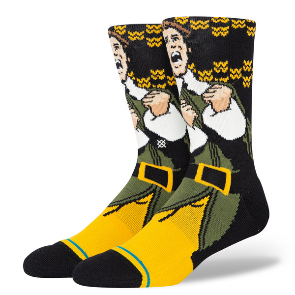 A pair of GREEN STANCE socks featuring the cartoon character, The Grinch.