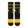A pair of STANCE socks with a yellow stripe.