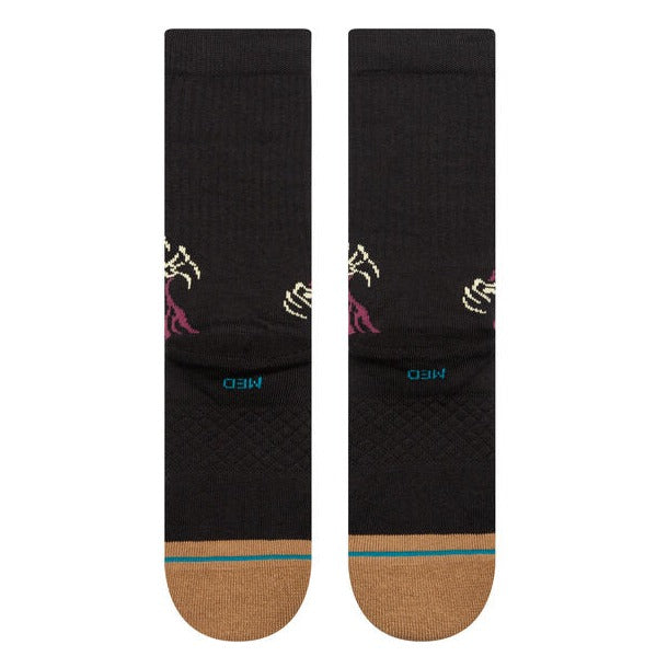 A pair of STANCE socks made with combed cotton for comfort and featuring colorful designs.
