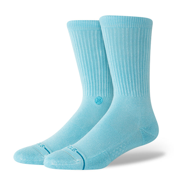 The STANCE SOCKS ICON DYED ELECTRIC BLUE LARGE by STANCE are electric blue crew socks with ribbed cuffs, made from a soft cotton blend and displayed upright against a plain white background.
