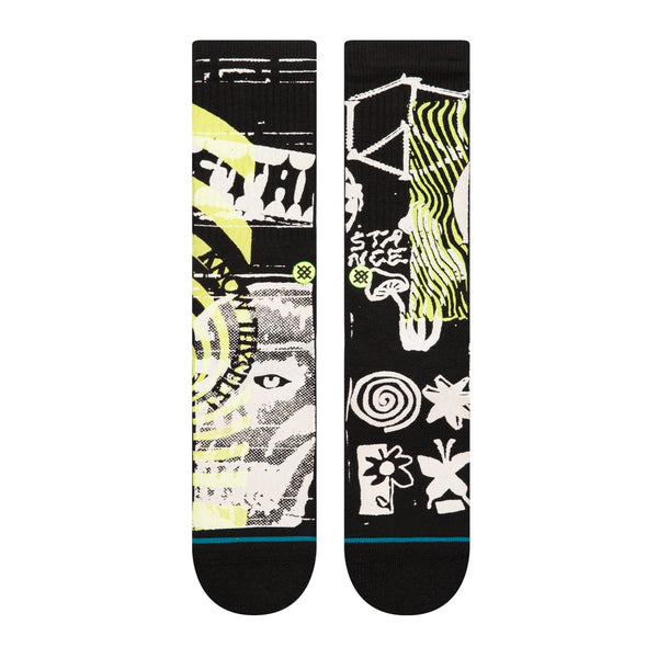 A pair of black STANCE socks with a design on them.