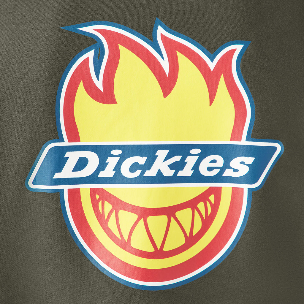 Logo of Dickies with a flame and grin graphic displayed on the olive green background of the DICKIES X SPITFIRE FLEECE HOODIE.