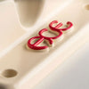 Close-up of a polished, beige object with the letters "ewe" in red, raised text positioned on the surface near two screw holes. The product is the **ACE AF1 66 LIMITED BRIAN ANDERSON (SET OF TWO)** from **Ace**.