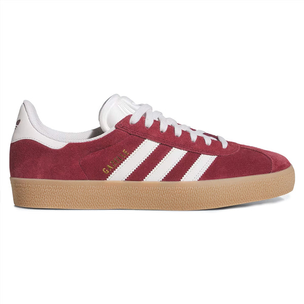 The ADIDAS GAZELLE ADV in Shadow Red, Crystal White, and Gold Metallic features classic white stripes, laces, a gum sole, and gold details—a timeless sneaker that balances style and performance.
