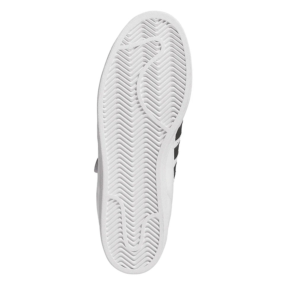The image shows the white, herringbone-patterned sole of the ADIDAS PRO SHELL FLAT WHITE / CORE BLACK sneaker by ADIDAS, photographed from the bottom against a plain background.
