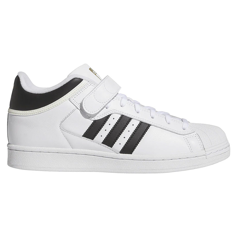 The ADIDAS PRO SHELL ADV FLAT WHITE / CORE BLACK is a low-top skate shoe with black stripes, a velcro ankle strap, and classic basketball-inspired design—reimagined for modern skateboarding style.