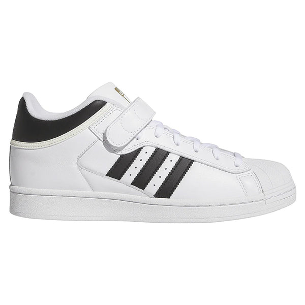 The ADIDAS PRO SHELL ADV FLAT WHITE / CORE BLACK is a low-top skate shoe with black stripes, a velcro ankle strap, and classic basketball-inspired design—reimagined for modern skateboarding style.