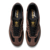 A pair of brown and gold ADIDAS SAMBA ADV X KADER BLACK / BROWN / GUM sneakers.