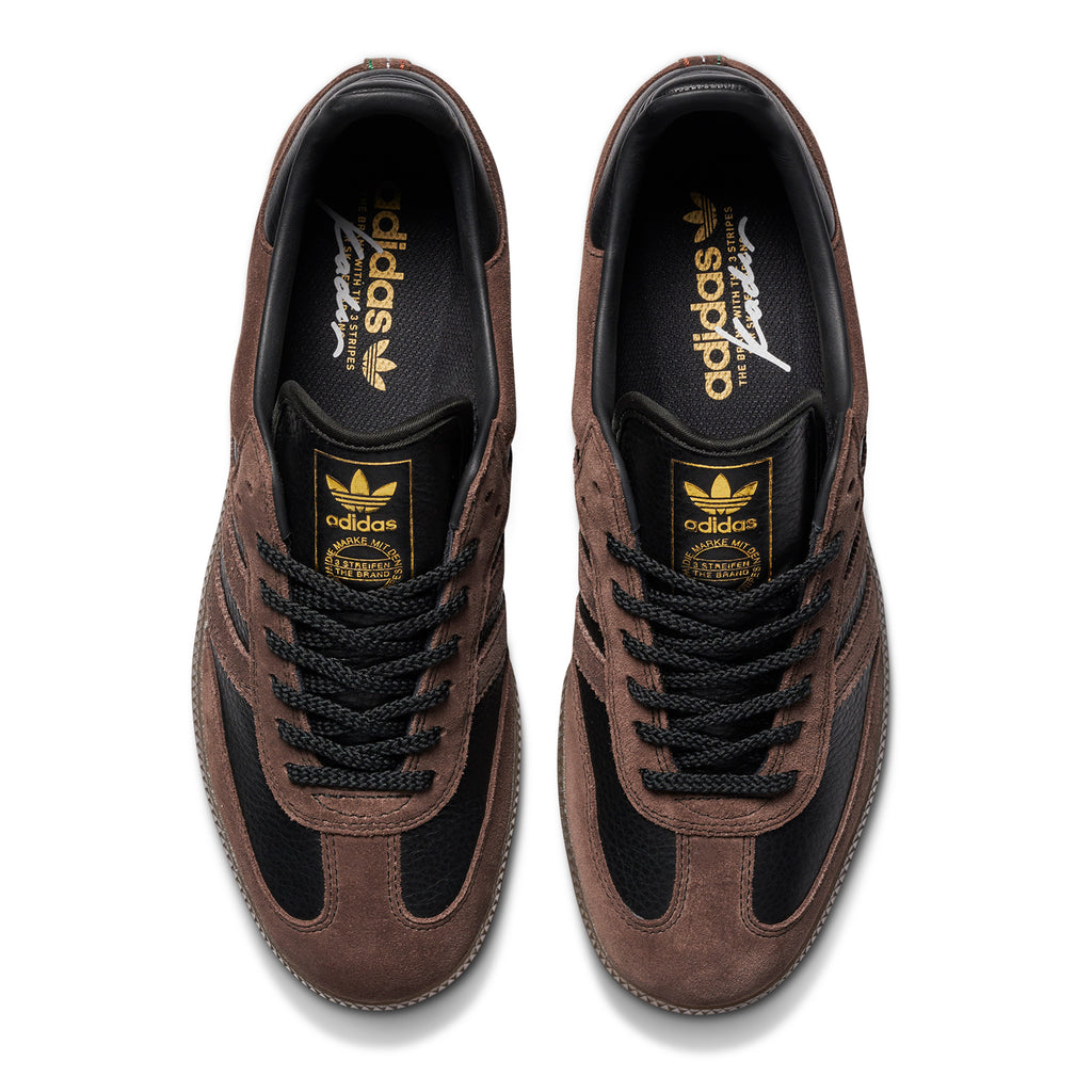 A pair of brown and gold ADIDAS SAMBA ADV X KADER BLACK / BROWN / GUM sneakers.