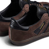 A pair of brown and black ADIDAS SAMBA ADV X KADER sneakers.